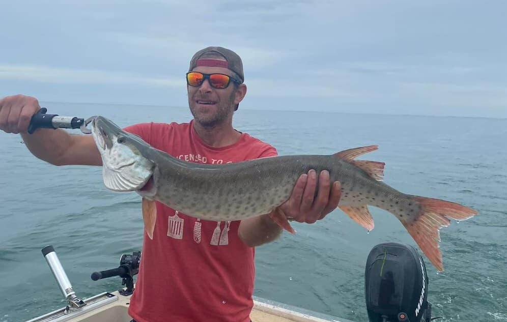 Guest Holding Musky Happy customer holding a musky he caught